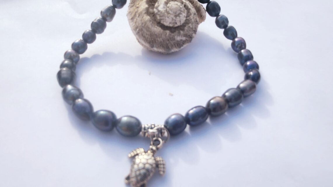 bracelet de cheville en perles noires tortue